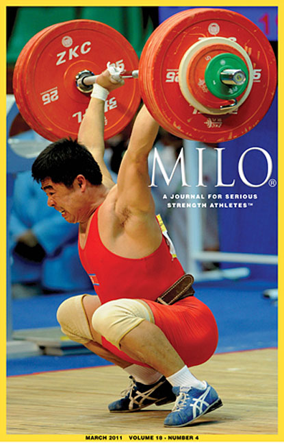 With this gritty effort, North Korea’s Pang Kum Chol managed to save this 192-kg squat jerk.  The 77-kg lifter had already won the gold medal, but he wasn’t about to kiss off his lift, and after getting rocked onto his toes and then back on his heels, he managed to control the bar and stand up.  This was the editor’s choice for Best Lift at the 2010 Asian Games.  IronMind® | Randall J. Strossen photo.