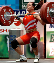 Dominika Misterska needed to clean and jerk 122.5 kg in order to bump Gergana Kirilova (Bulgaria) from silver medal position in both the jerk and the total, and that is just what she did. IronMind® | Randall J. Strossen, Ph.D photo.