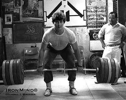 Yoshinobu Miyake keeps a close eye on Nicu Vlad at The Sports Palace, where the Olympic gold medalists were visiting Jim Schmitz and wowing their fellow weightlifters.  IronMind® | Randall J. Strossen photo.