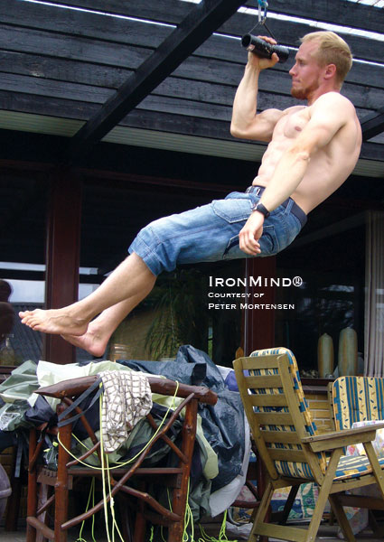 Peter Mortensen, a rock climber from Denmark, does a one-arm pull-up on a Rolling Thunder® Revolving Deadlift Handle:  “There seems to be a strong correlation between strength on revolving handles or dumbbells (especially thick handles) and climbing hand strength . . .,” Peter told us.  Reprinted from the 2009 IronMind® catalog - Volume Eighteen, with permission.  IronMind® | Photo courtesy of Peter Mortensen.