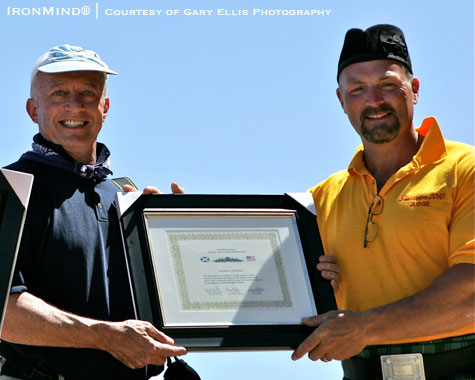IHGF vice president Francis Brebner (right) presented an award to IronMind’s Randall Strossen (left), for MILO’s coverage of the Highland Games.  IronMind® | Courtesy of Gary Ellis Photography.