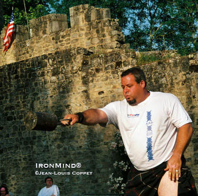 In what might be a perfect setting, five-time Highland Games World Champion Ryan Vierra throws the 56-pound weight for height in Bressuire, France.  IronMind® | Jean-Louis Coppet photo.