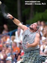 "Fly," Ryan Vierra says to the Braemar Stone (Fergus, Ontario). Nice vapor trail. IronMind® | Randall J. Strossen, Ph.D. photo.