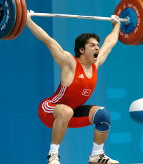 Taner Sagir (Turkey) produced an electrifying performance at the Athens Olympics, which included this 172.5-kg snatch. Not too shabby for a 77-kg teenager, huh? IronMind® | Randall J. Strossen, Ph.D. photo.