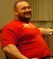 Brian Schoonveld relaxes yesterday at the Odd Haugen-Josh Bryant strongman seminar at the FitExpo. IronMind® | Randall J. Strossen, Ph.D. photo.