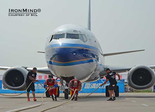 Zydrunas Savickas and Hafthor Bjornsson team up to pull a jet at SCL China, billed as the contest that would supersize strongman.  IronMind® | Photo courtesy of SCL.