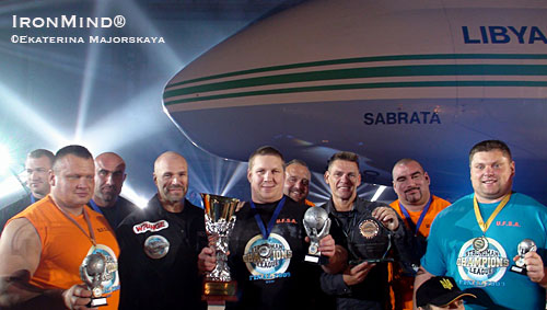 Strongman Champions League: Andrus Murumets (center), the overall 2009 Strongman Champions League (SCL) Champion, is flanked by SCL cofounders, Ilkka Kinnunen (left) and Marcel Mosert (right).  Agris Kazelniks, second overall, is on the far left, and Zydrunas Savickas, third overall, on on the far right.  IronMind® | Ekaterina Majorskaya photo.