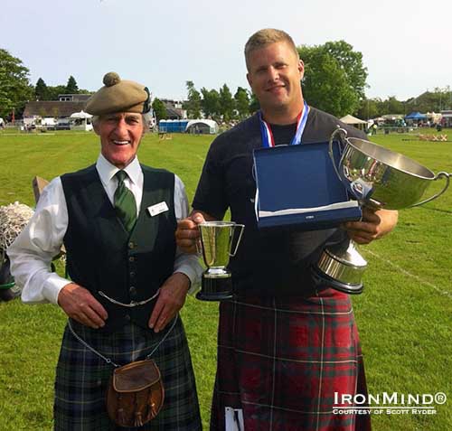 Flanked by Chieftain of the Loch Lomond Highland Games, Major James Macrae, Highland Games world champion Scott Rider sports the spoils of victory.  IronMind® | Photo courtesy of Scott Rider.