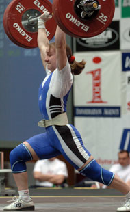 Making it look easy, Marina Shainova jerks 125 kg on her second attempt, all she needed for a three-gold-medal day. IronMind® | Randall J. Strossen, Ph.D photo.