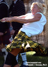 Taking her final throw, Shannon Hartnett - who opened the door to Highland Games Heavy Events for women and who is an inspiration to many people - hammers the field one last time at Pleasanton, California. IronMind® | Randall J. Strossen, Ph.D. photo.