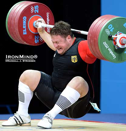 In a devastating hit, Matthias Steiner was clocked in the back of the neck when he missed this 196-kg snatch at the London Olympics.  IronMind® | Randall J. Strossen photo.
