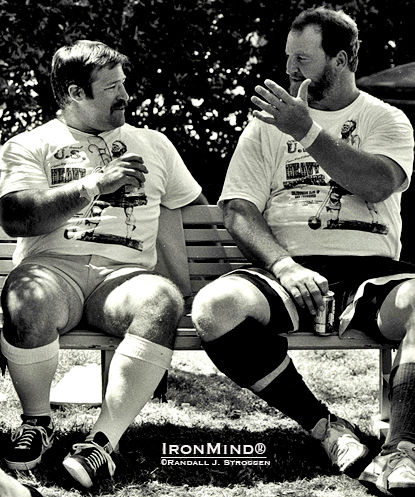 Steve Jeck (left) picks Ben Plucknett’s brain at the 1994 US Invitational Heavy Events Championships in Pleasanton, California.  Randall J. Strossen photo.