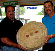 Steve Jeck (left) and Richard Sorin (right) with Richard's millstone (did Goliath lose a button?) at the grip reunion held at Sorinex last month. IronMind® | Randall J. Strossen, Ph.D. photo.