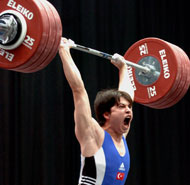 Taner Sagir (Turkey) roars his approval as he made an easy 192.5-kg first attempt clean and jerk, winning all three gold medals in the 77-kg category at the European Weightlifting Championships today. IronMind® | Randall J. Strossen, Ph.D. photo.