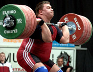 Victory in hand, Vicktors Schyrbatihs (Latvia) comes up with a 250-kg clean and jerk to claim the superheavyweight title at the European Weightlifting Championships today. IronMind® | Randall J. Strossen, Ph.D. photo.