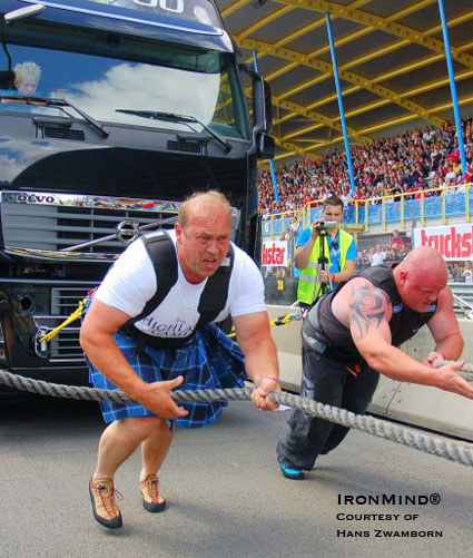 People Pulling Trucks