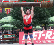 Don Pope, on the Log Lift during the qualifiers at the 2005 MET-Rx World's Strongest Man contest, is in first place overall after the first day of the finals. IronMind® | Photo courtesy of Andy Lazell.