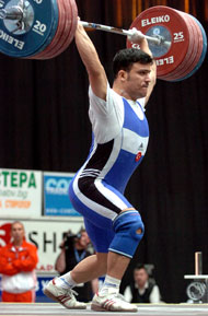 Hakan Yilmaz (Turkey) sticks 215 kg on his opening clean and jerk and that was all it took to catapult him to the gold medal. IronMind® | Randall J. Strossen, Ph.D. photo.