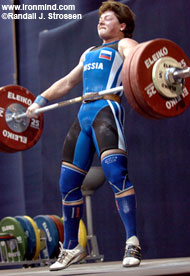 Natalia Zabolotnaya cranks on 130 kg, breaking the junior and senior world records she had set in the snatch just minutes earlier. IronMind® | Randall J. Strossen, Ph.D. photo.