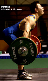 There's nothing wishy-washy about the position of Zhong Gusohun's back as he accelerates 145 kg on his second attempt in the snatch. IronMind® | Randall J. Strossen, Ph.D. photo.