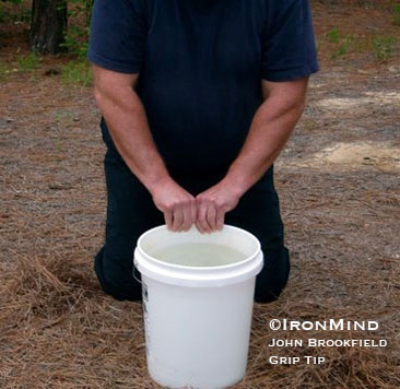 Drive your hand into the water (above) and then open it explosively for improved grip strength and hand health.  ©IronMind/John Brookfield Grip Tip.